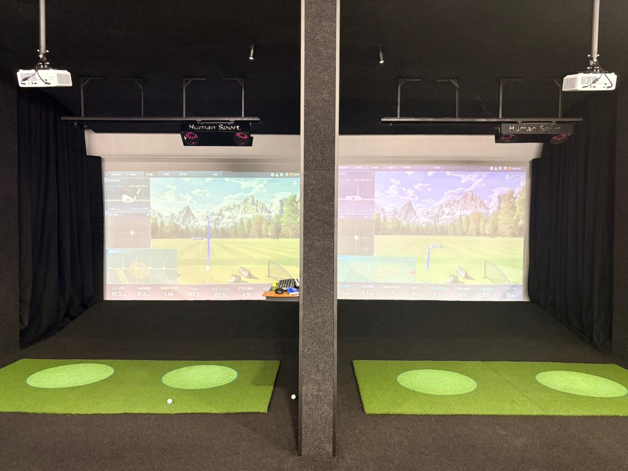 dual bay indoor golf simulator setup under lights